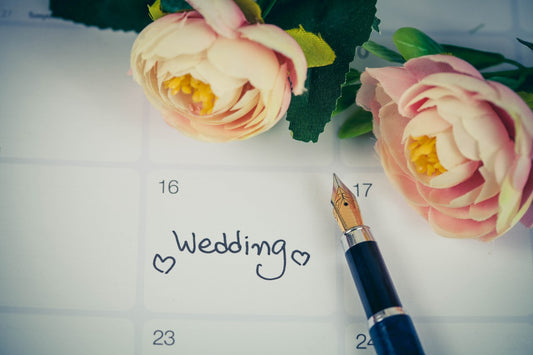 wedding day reminder in calendar with flower and fountain pen