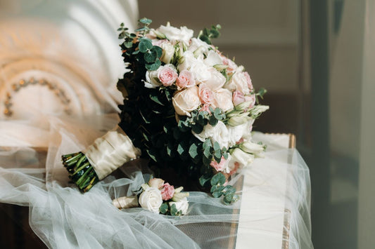 wedding bouquet with roses and boutonniere